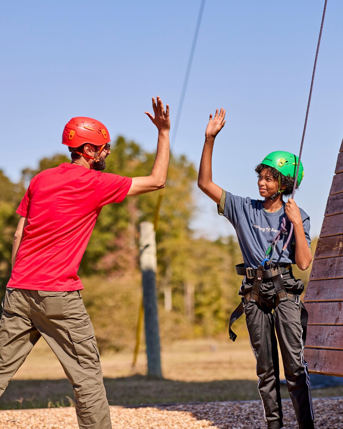 Scout celebrating after climbing