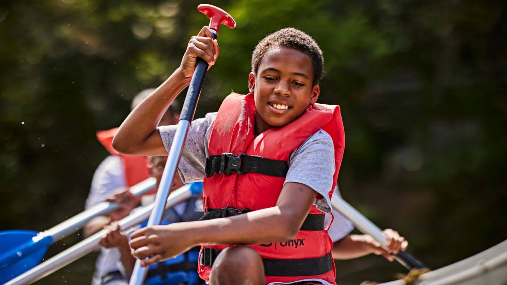Scouts kayaking outdoors
