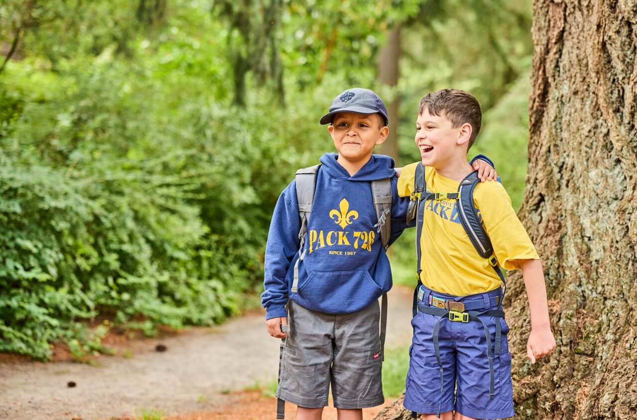 Two Scouts smiling together outdoors