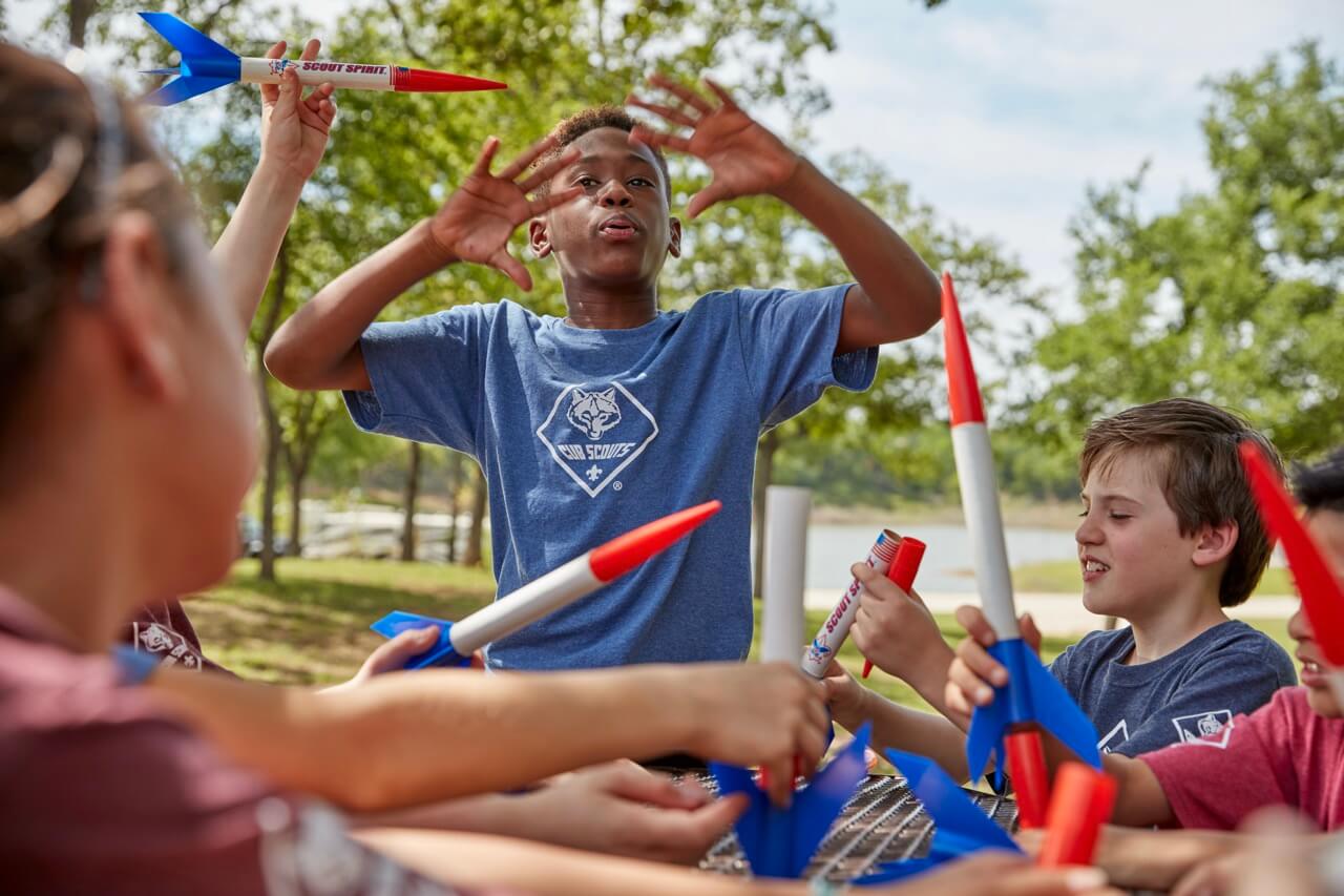 Cub Scouts enjoying activities together outdoors